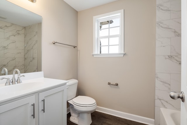 bathroom featuring hardwood / wood-style flooring, vanity, and toilet