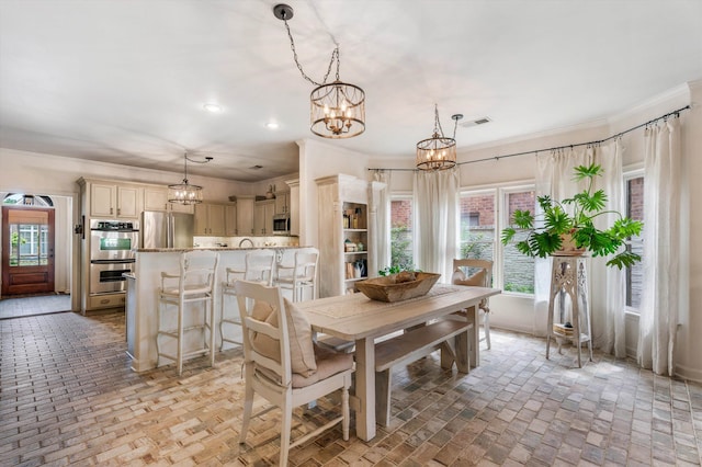 dining area with ornamental molding