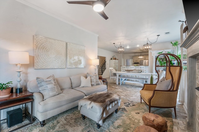 bedroom with a fireplace, ornamental molding, and a chandelier