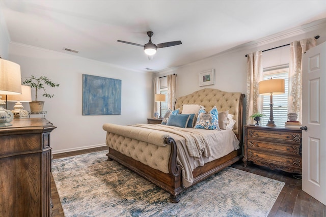 bedroom featuring ceiling fan, ornamental molding, and dark wood-type flooring