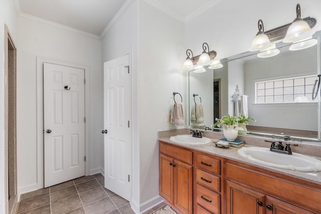 bathroom with crown molding, tile patterned flooring, and vanity