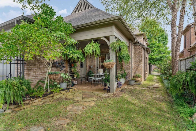 exterior space featuring a patio and a yard