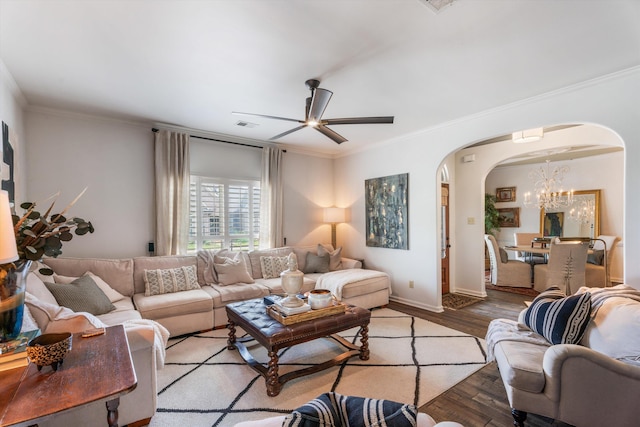 living room with light wood-type flooring, ceiling fan with notable chandelier, and ornamental molding