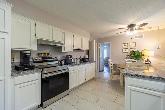 kitchen featuring range hood, electric stove, a textured ceiling, and white cabinetry