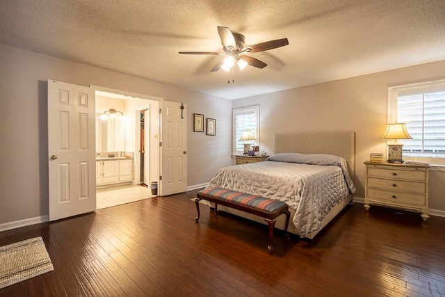 bedroom with multiple windows, a textured ceiling, dark hardwood / wood-style flooring, and ceiling fan