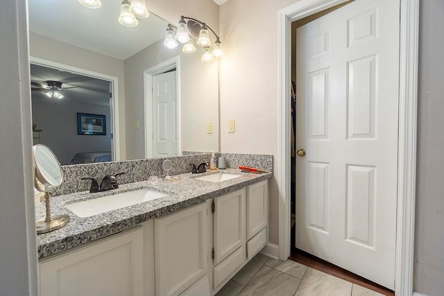 bathroom featuring vanity and ceiling fan