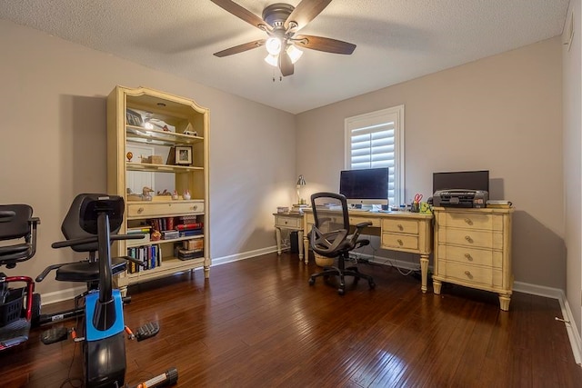 home office featuring ceiling fan, a textured ceiling, and dark wood-type flooring