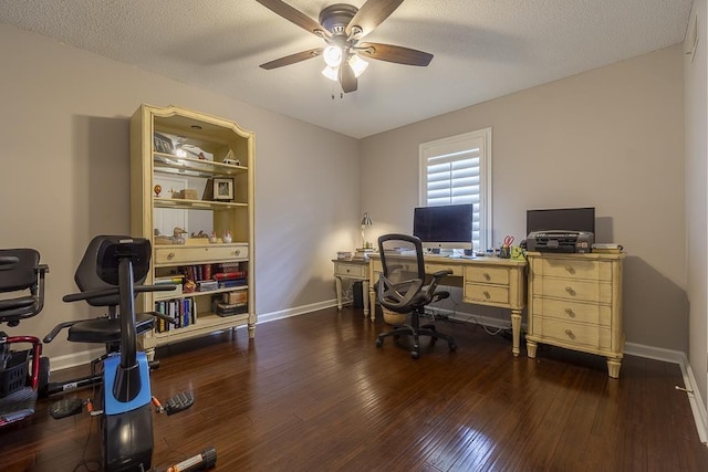 7150 Woodridge Ln, Germantown, TN 38138 - office area featuring dark wood-style flooring, a ceiling fan, and baseboards