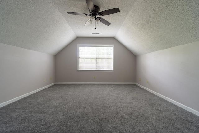 7150 Woodridge Ln, Germantown, TN 38138 - bonus room with a textured ceiling, ceiling fan, carpet floors, lofted ceiling, and visible vents