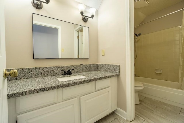 full bathroom with vanity, toilet, and shower / bath combo