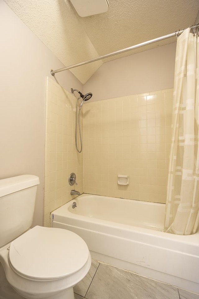 7150 Woodridge Ln, Germantown, TN 38138 - full bathroom with a textured ceiling, tile patterned floors, toilet, and shower / bathtub combination with curtain