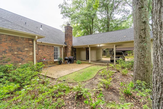 rear view of house featuring a patio