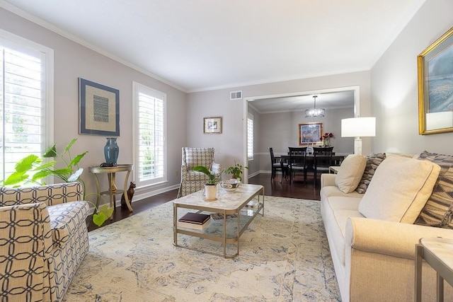 7150 Woodridge Ln, Germantown, TN 38138 - living room with baseboards, ornamental molding, wood finished floors, and visible vents