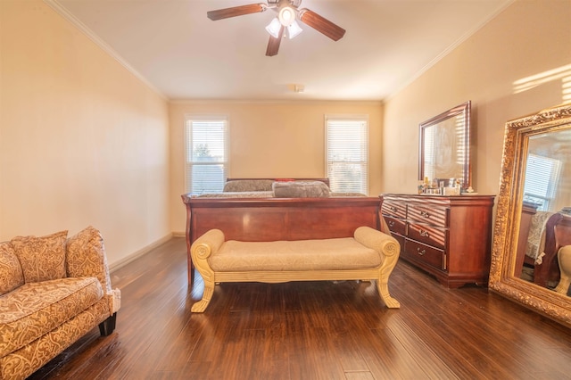 bedroom featuring ceiling fan, dark hardwood / wood-style floors, and crown molding