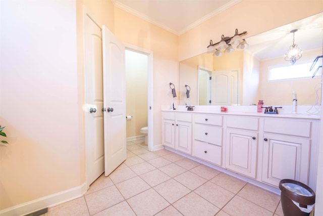 bathroom featuring crown molding, vanity, toilet, and tile patterned floors