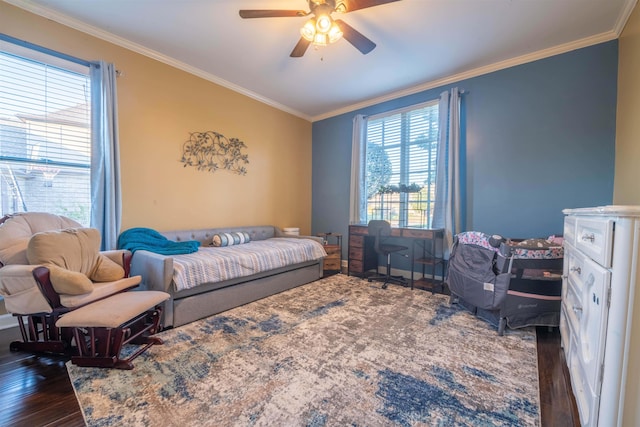 bedroom featuring ceiling fan, crown molding, and dark hardwood / wood-style flooring