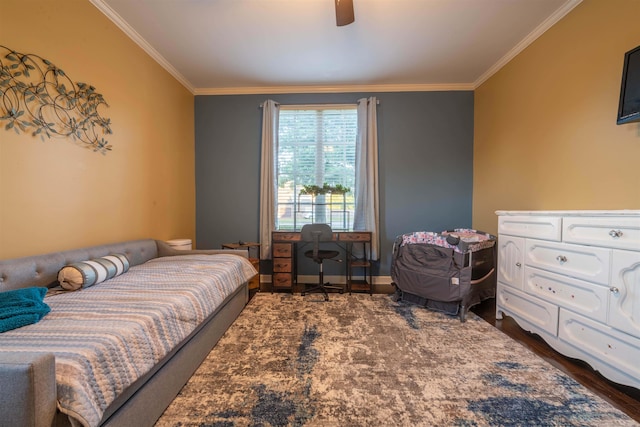 bedroom with ornamental molding, dark hardwood / wood-style flooring, and ceiling fan