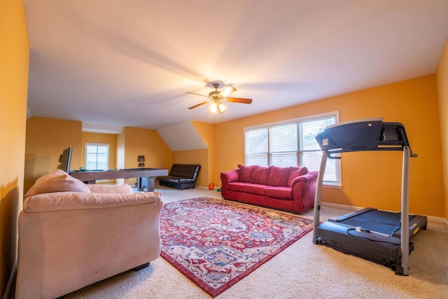 carpeted living room featuring ceiling fan and vaulted ceiling