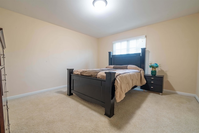 bedroom with light colored carpet