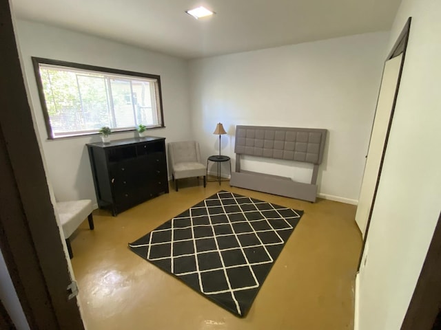 living area featuring concrete floors