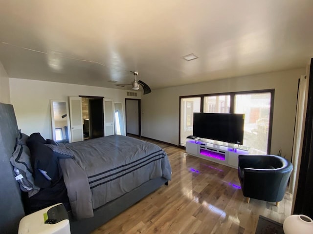 bedroom with hardwood / wood-style floors