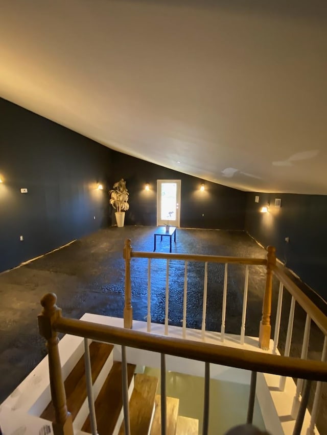 staircase featuring vaulted ceiling