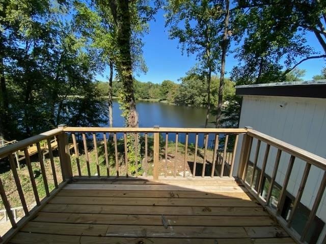 wooden deck featuring a water view