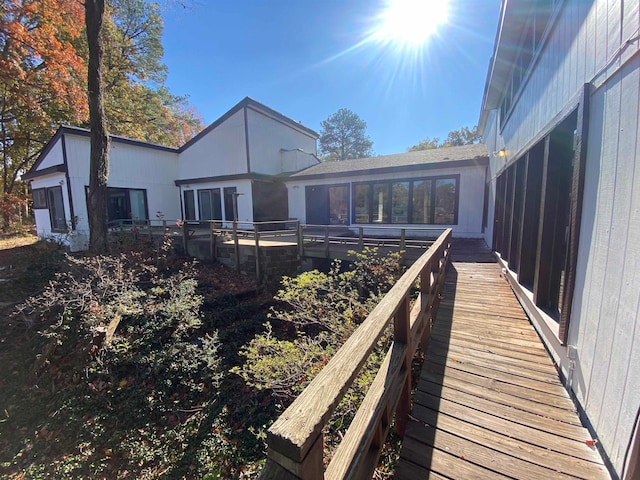 back of house featuring a sunroom