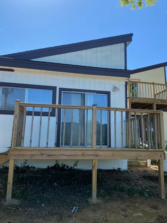 rear view of house featuring a deck