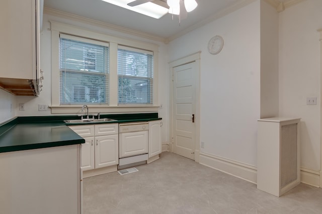 kitchen with ceiling fan, sink, white cabinetry, dishwasher, and crown molding