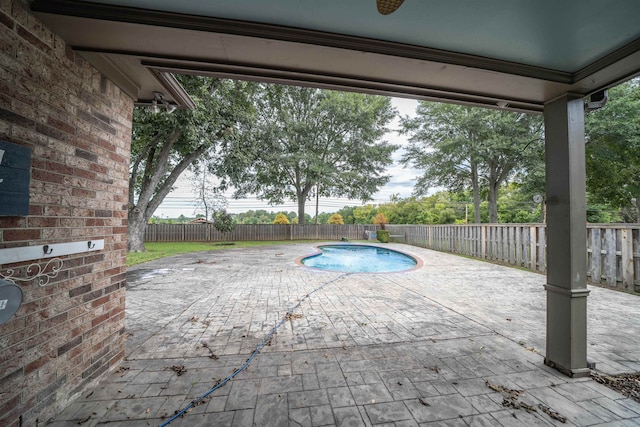 view of swimming pool featuring a patio area