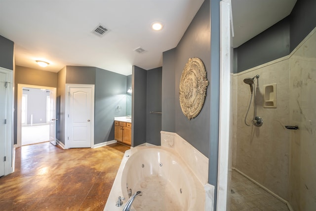 bathroom with vanity and separate shower and tub