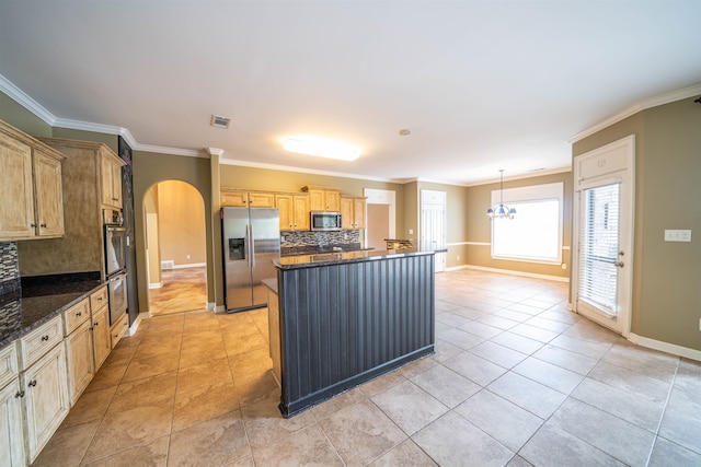 kitchen with light brown cabinets, tasteful backsplash, decorative light fixtures, stainless steel appliances, and crown molding