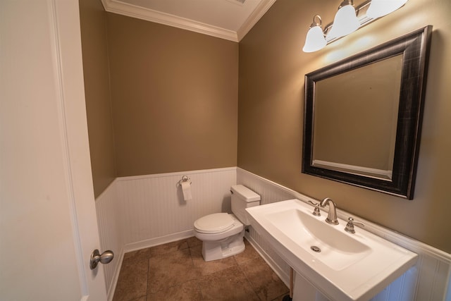 bathroom featuring ornamental molding, tile patterned flooring, sink, and toilet