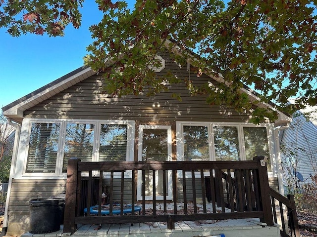 view of side of property featuring a deck