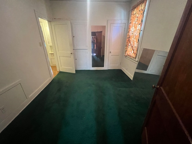 bedroom featuring dark colored carpet