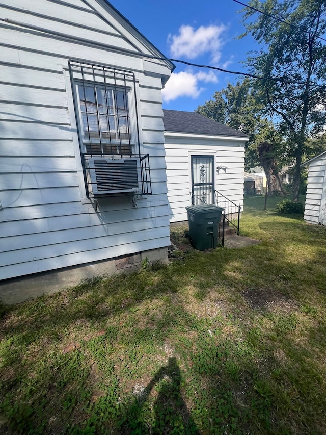 view of side of home featuring a yard