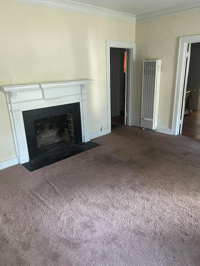 unfurnished living room with ornamental molding and dark carpet