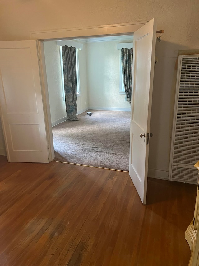 corridor featuring hardwood / wood-style flooring