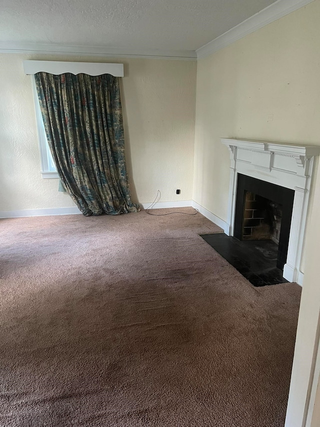 unfurnished living room with carpet floors, a textured ceiling, and ornamental molding