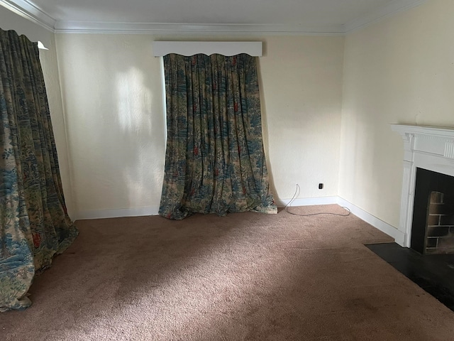 unfurnished living room featuring ornamental molding and carpet flooring