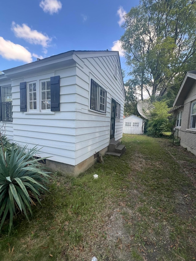 view of home's exterior featuring a yard