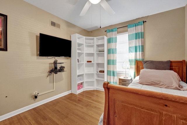 bedroom featuring light hardwood / wood-style flooring and ceiling fan