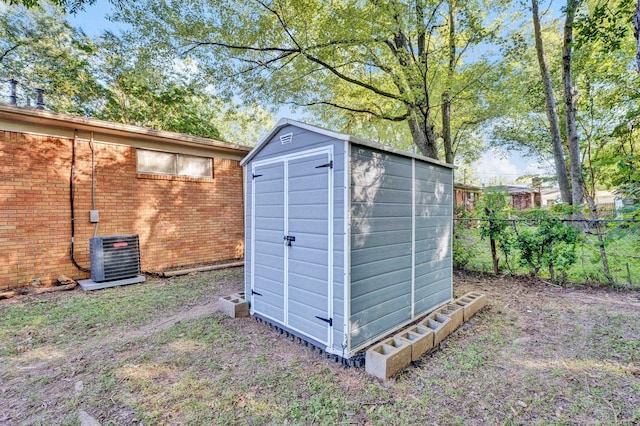 view of outdoor structure featuring central AC unit