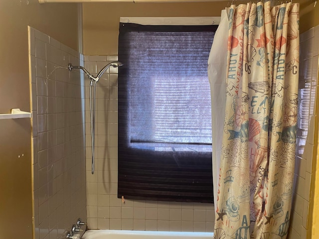 bathroom featuring shower / bathtub combination with curtain