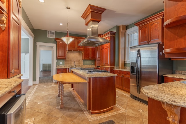 kitchen with a kitchen island, decorative light fixtures, decorative backsplash, appliances with stainless steel finishes, and light tile patterned floors