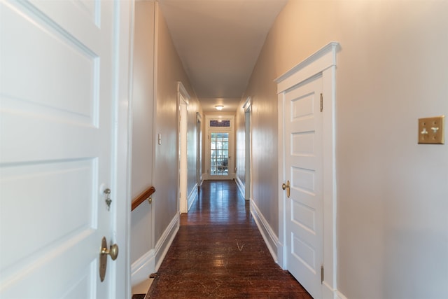 hallway with dark wood-type flooring