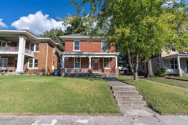 view of front of home with a porch and a front yard