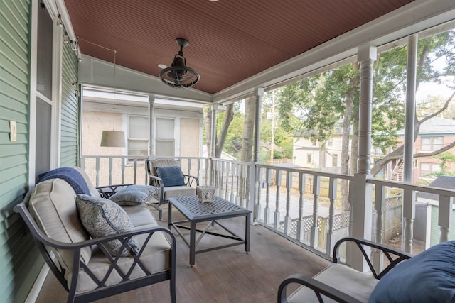 sunroom / solarium featuring wood ceiling and vaulted ceiling