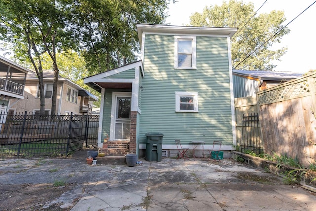 back of house with a patio